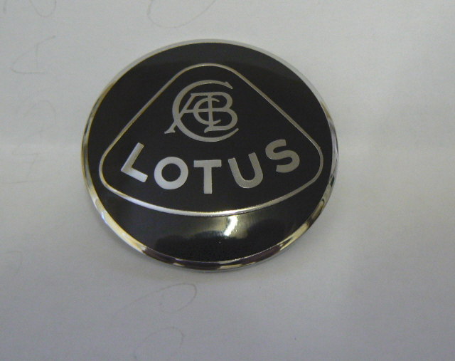 C036B0269F (036B0269) NOSE BADGE (Black and Silver)